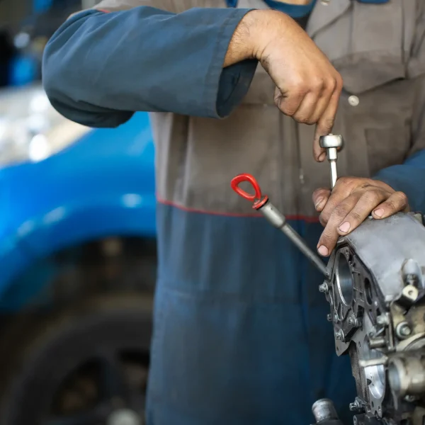 an-auto-mechanic-repairs-an-internal-combustion-en-2025-01-10-20-37-41-utc